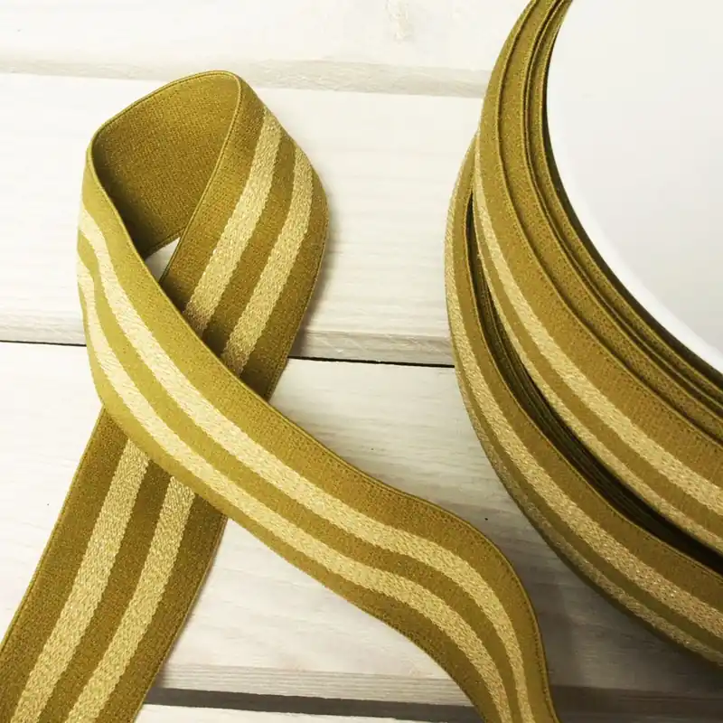 Solange Der Vorrat Reicht 3cm breites weiches Gummiband mit Metallic Streifen khaki gold – Hosengummi für Shorts und Röcke