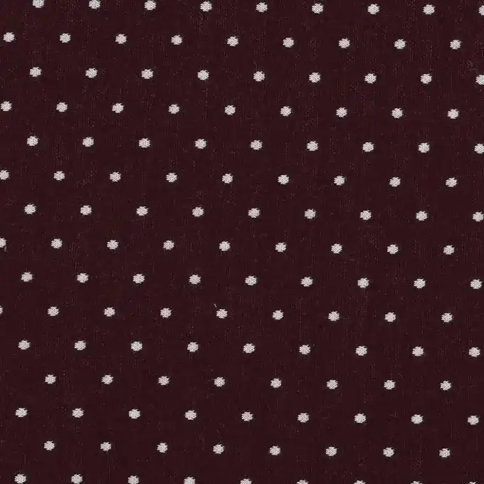 Bordeauxfarbener Strickstoff mit Punkten Aktuell