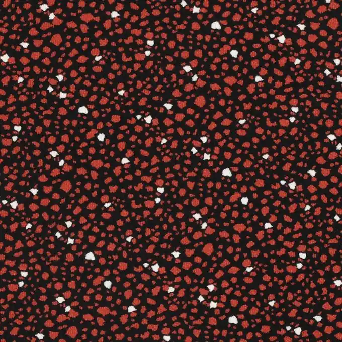 Bestseller Kreppstoff mit roten Flecken.